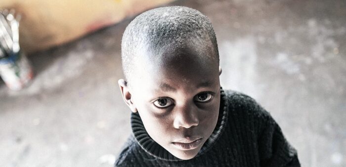 Portrait of a boy in the Townships, Cape Town, South Africa. Copyright © 2022 Terence Carter / Grantourismo. All Rights Reserved. Donate Money, Win a Home 'Away', Build a Village in India.