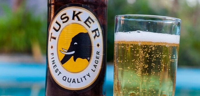 Shopping List – what things cost in Diani Beach, Kenya. Tusker beer, poolside, Diani Beach, Mombasa, Kenya. Copyright © 2022 Terence Carter / Grantourismo. All Rights Reserved.