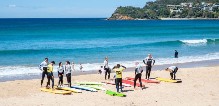 Escape to Manly, a Seaside Holiday Town in the City of Sydney. Surfing Lesson at Manly Beach, Sydney, Australia. Copyright © 2022 Terence Carter / Grantourismo. All Rights Reserved.