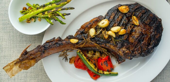 Best Bangkok Restaurants on Asia's 50 Best Restaurants List. Australian Wagyu Tomahawk with Grilled Vegetables, and Potato Chips (serves 3 to 4 people). Eat Me Restaurant, Bangkok, Thailand. Copyright © 2022 Terence Carter / Grantourismo. All Rights Reserved.
