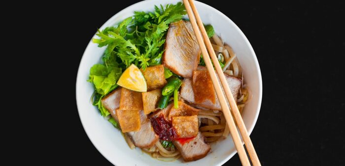 Our Favourite Local Noodle Shop In Hoi An in Central Vietnam. Cao Lau Noodles, Hoi An old town, Vietnam. Copyright © 2022 Terence Carter / Grantourismo. All Rights Reserved.