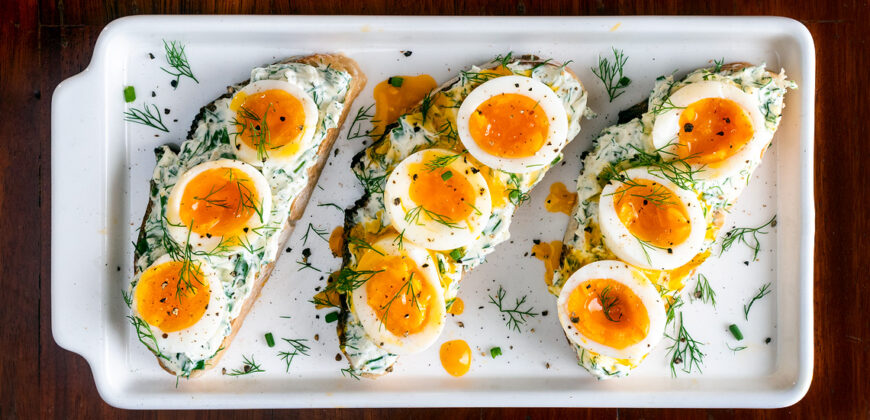 Mothers Day Breakfast Recipes for Mums Who Love Breakfast in Bed. Jammy Soft Boiled Eggs on Sourdough Toast with Dill Cream Cheese with Pickles. Copyright © 2023 Terence Carter / Grantourismo. All Rights Reserved.