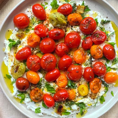 Greek Style Blistered Cherry Tomatoes on Goat’s Cheese Recipe with Herbs and Olive Oil. Copyright © 2024 Terence Carter / Grantourismo. All Rights Reserved.