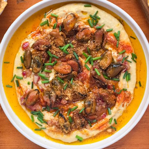 Smoked Mussels on Hummus with Smoky Paprika and Chives. Copyright © 2024 Terence Carter / Grantourismo. All Rights Reserved.