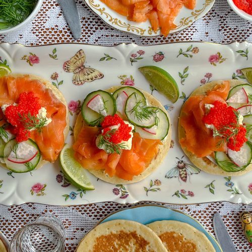 Smoked Trout Blini with Caviar, Crème Fraîche, Cucumber, Radish and Dill. Copyright © 2024 Terence Carter / Grantourismo. All Rights Reserved.