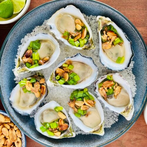 Vietnamese Grilled Oysters Recipe with Scallion Oil, Peanuts and Crunchy Shallots. Copyright 2026 Lara Dunston Terence Carter Grantourismo